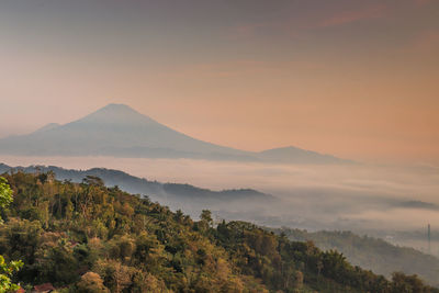 Scenic view of mountains against sky during sunset