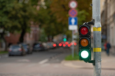 View of traffic signal on road in city