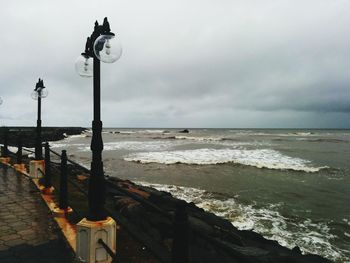 Pier on sea against sky