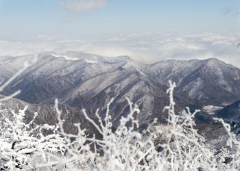 Scenic view of mountains against sky during winter