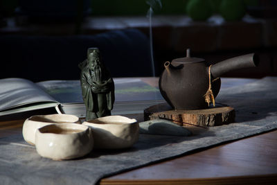 Close-up of statue on table