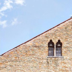 Low angle view of old building against sky