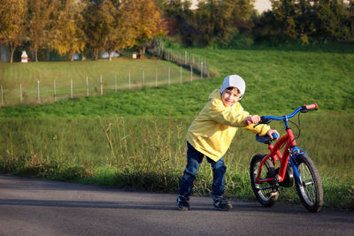 Man riding bicycle on road