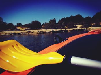 Close-up of yellow car against sky