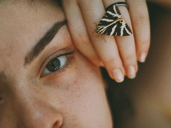 Close-up portrait of woman with eyes closed