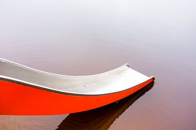 High angle view of red boat moored in lake