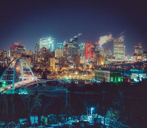 Illuminated buildings in city at night