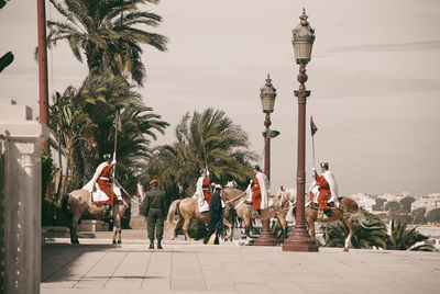 Group of people walking on street