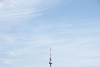 Low angle view of communications tower against sky