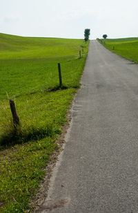 Road passing through field