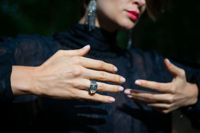 Midsection of woman with hands