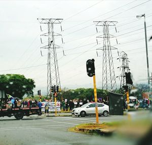 Cars on road against sky