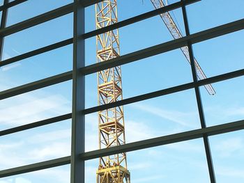 Low angle view of metal structure against sky