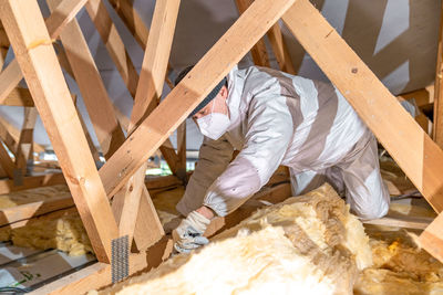 High angle view of man standing on table