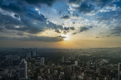 High angle view of buildings against sky during sunset