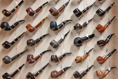 Close-up of smoking pipe on wall