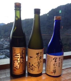 Close-up of wine bottles on table