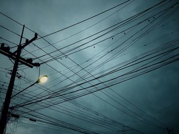 Low angle view of electricity pylon