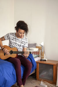 Young man playing guitar