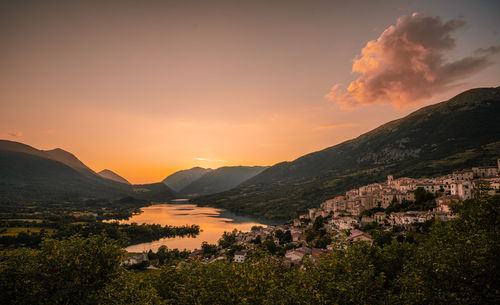Scenic view of townscape against sky during sunset