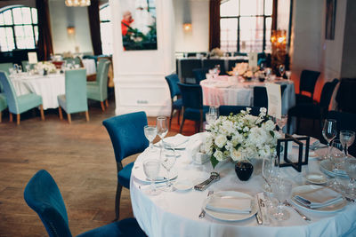 Empty chairs and tables in restaurant