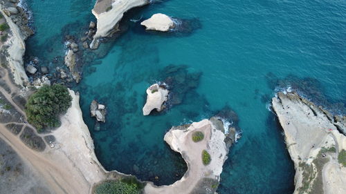 High angle view of rocks on sea