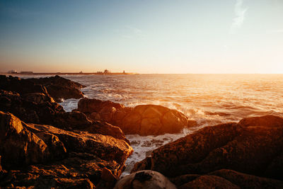 Scenic view of sea against sky during sunset