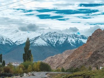 Scenic view of snowcapped mountains against sky