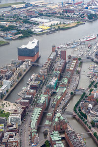 High angle view of river amidst buildings in city