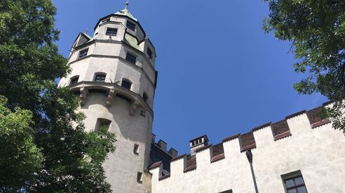 Low angle view of building against clear blue sky