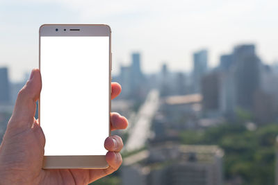 Close-up of hand holding mobile phone