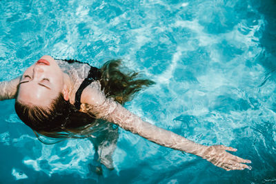 High angle view of man swimming in pool