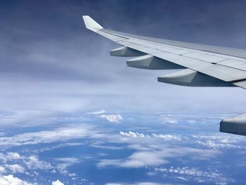 Aerial view of airplane flying in sky