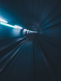 Blurred motion of railroad track in tunnel