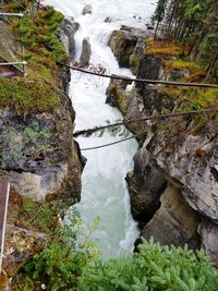 High angle view of waterfall by river