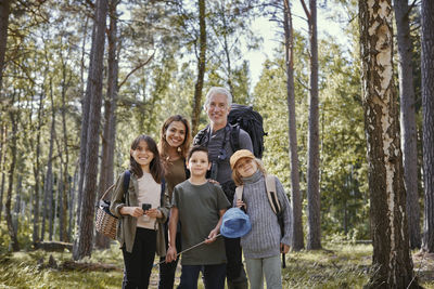 Full length of father and daughter in forest