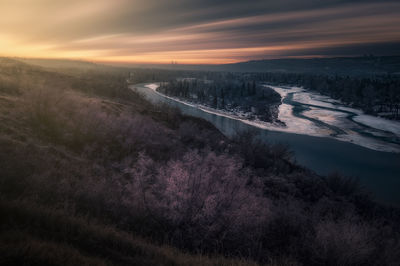 High angle view of land against sky during sunset