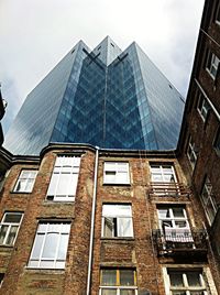 Low angle view of modern building against sky