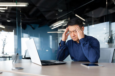 Businesswoman working at desk in office