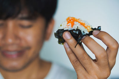 Close-up of man holding ice cream