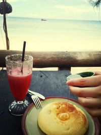 Cropped image of woman eating food