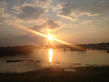 Scenic view of sunset over lake