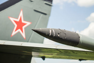 Low angle view of airplane against sky