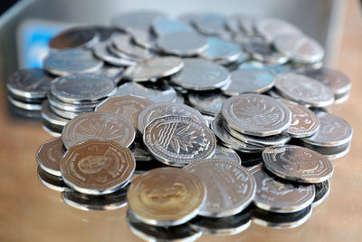 Close-up of coins on table