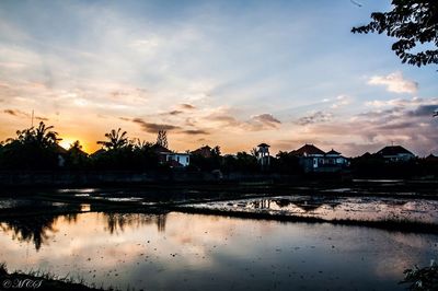 View of calm lake at sunset