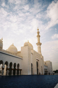 Low angle view of mosque against sky