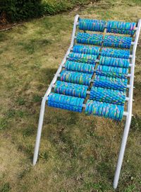 High angle view of empty chairs on field