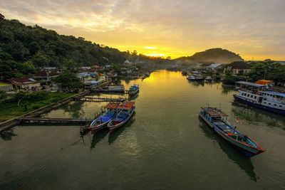 High angle view of boats in water at sunset