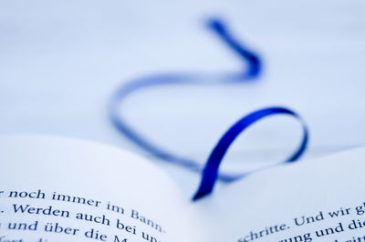 Close-up of book with blue bookmark