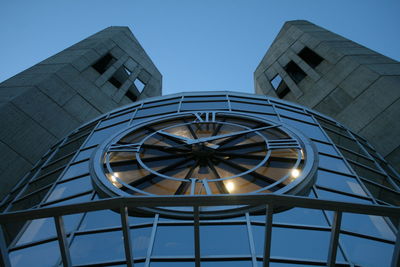 Low angle view of illuminated building against clear blue sky